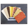 Autumn Triangles quilt kit fabrics arranged on cutting mat