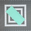 Triangle Love mint tonal fat quarter on cutting mat
