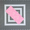 Triangle Love pink fat quarter with delicate white speckles