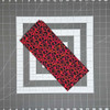 Triangle Love black and red fat quarter with scrolling heart pattern