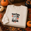 Too Cute to Spook ghost embroidery on cream sweatshirt with Halloween decor