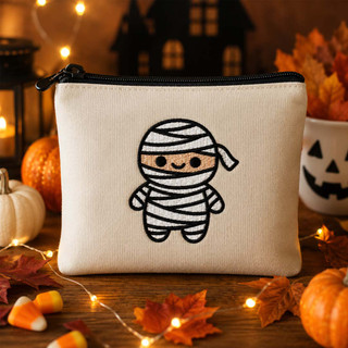 Cute mummy embroidery design stitched on a cream zipper pouch