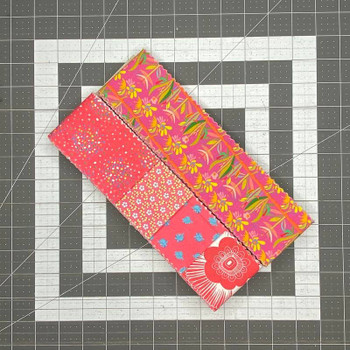 Roll of Pink 2.5-inch precut fabric strips