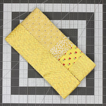 Roll of Yellow 2.5-inch precut fabric strips