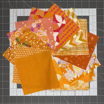 Orange Color Story 5-inch fabric squares in assorted orange and yellow prints