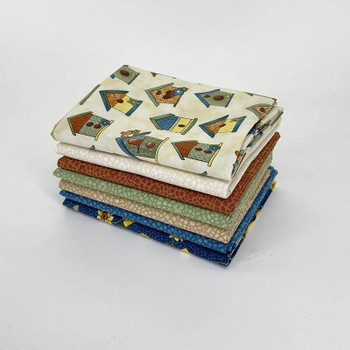 Folded Tan fat quarter fabric bundle