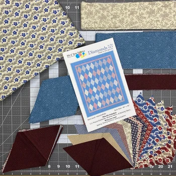 Diamonds in the Sky quilt kit with blue, cream, burgundy fabrics and pattern