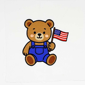 Patriotic teddy bear embroidery holding an American flag