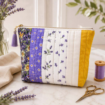 Golden Meadow fabric bundle sewn into a purple, cream, and mustard zippered pouch