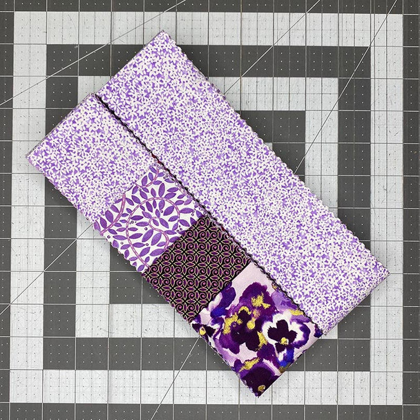 Roll of Purple 2.5-inch precut fabric strips