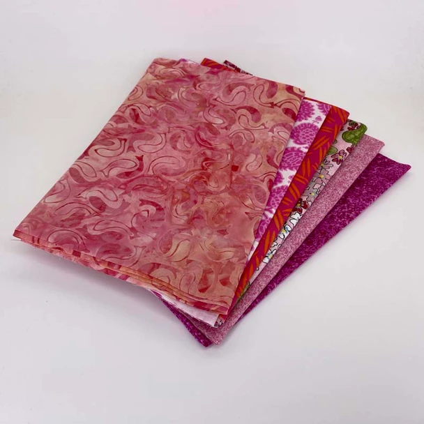 Folded Pink fat quarter fabric bundle