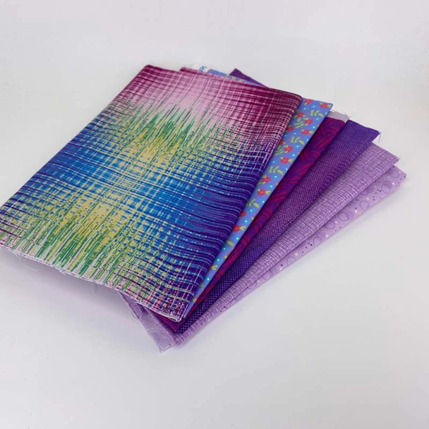 Folded Purple fat quarter fabric bundle