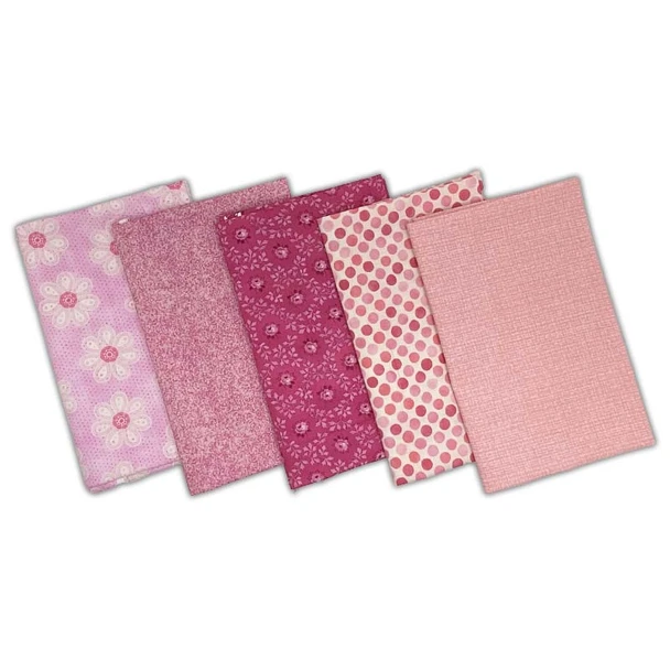 Five pink fat quarter fabrics in floral, tonal, geometric, and solid-style prints