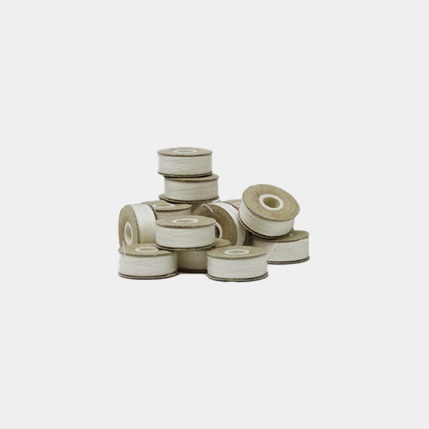 Ten Madeira fire resistant Style L bobbins stacked on white background