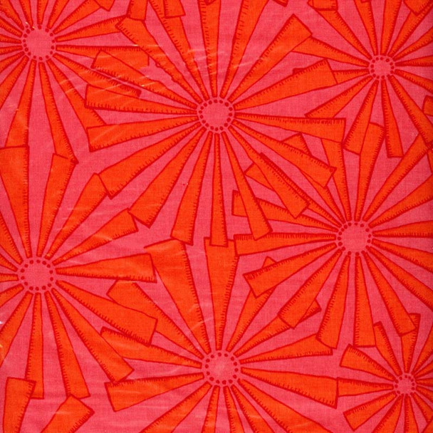 Punctuated Exclamation Orange Crush fabric with red-orange sunburst motifs