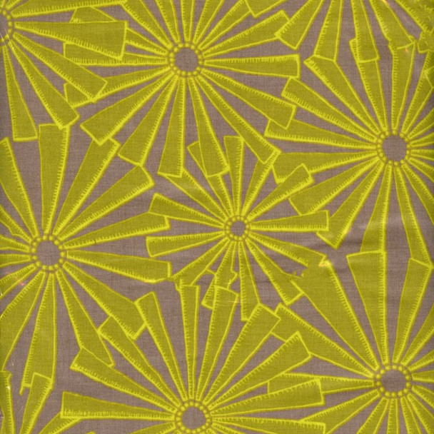 Punctuated Exclamation Olive fabric with yellow-green sunburst motifs