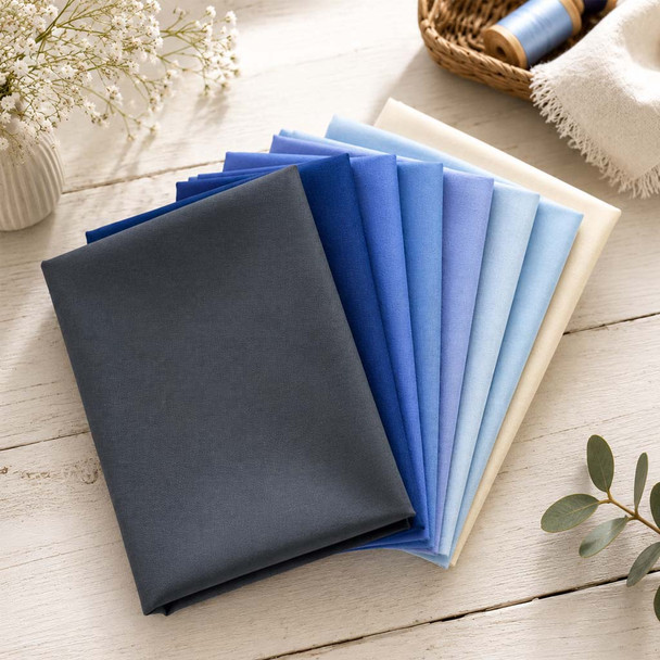 Stormy Skies fabric bundle in folded navy-to-light-blue gradient solids