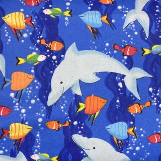 dolphins and fish in an ocean fabric pattern
