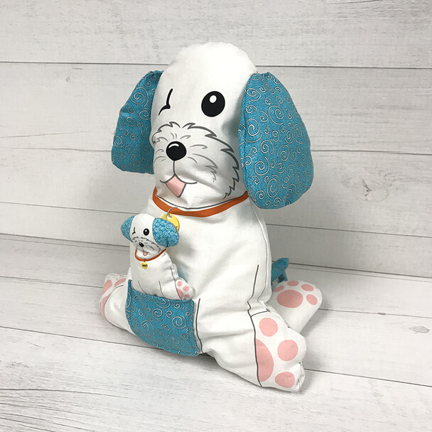 A smiling stuffed dog with blue ears