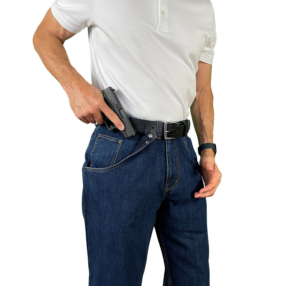 Man, fast drawing a gun from CCW Breakaways concealed carry DENIM JEANS with an enlargeable breakaway, or a break-open, built-in holster-pocket.