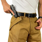 Close-up of a man drawing a gun from CCW Breakaways concealed carry HONEY GOLD JEANS shorts with an enlargeable opening to ensure a fast draw and no monkey-trapped hand in the pocket.