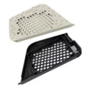 The object is depicted as small and flat with many holes in it. This image also shows another alternate version in black/ 