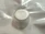 The Air10 replacement dial attaches to the device to adjust the pressure settings. It is very small, flat and circular. The picture is the top view of the product.