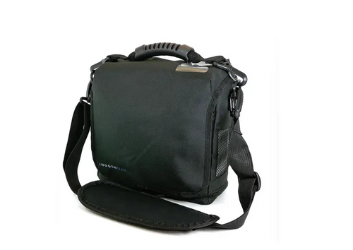 Has grab handle on top and shoulder strap as well 