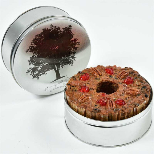 light fruitcake in a gift tin