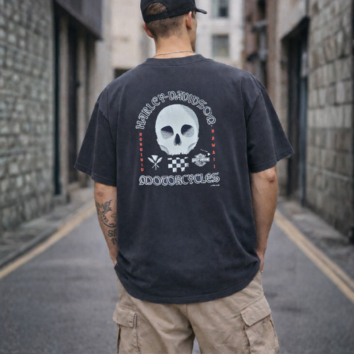 Rear view of Harley-Davidson Men's BadMan T-Shirt in Overdye Black displaying stark-white skull and Honolulu Hawaii back graphic