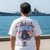 Rear view of Harley-Davidson Men's Pearl Harbor Battleship T-Shirt in White displaying battleship and American flag wings back graphic