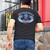 Rear view of Harley-Davidson Men's Kona Tiki Wave T-Shirt in Black displaying blue tiki and ocean wave back graphic