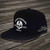 Exclusive Pacific Harley-Davidson Cycle City Skull Flat Brim Cap in Black featuring white helmeted skull embroidery and Pacific H-D side script