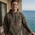 Front view of the Harley-Davidson Men's Tiki Brah Hooded Fleece in Darkwood camo showcasing the custom Tiki and Pacific H-D graphic