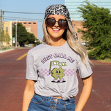 Just Call Me Lucky DTF Heat Transfer, image of a woman wearing a t-shirt with a Lucky character holding a flag and the text "Just Call Me Lucky" on it.