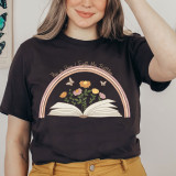 This Is How I Fight Screen Print Heat Transfer, woman wearing a black T-shirt with a colorful floral and rainbow design and the phrase 'This is How I Fight My Battles'.