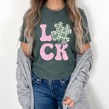 Luck Shamrock DTF Heat Transfer, colorful shamrock and bold pink letters spelling LICK on a green T-shirt.