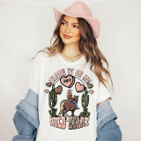 Blame It On My Wild Heart Screen Print Heat Transfer, colorful graphic t-shirt featuring hearts, a woman on a horse, and cacti design.