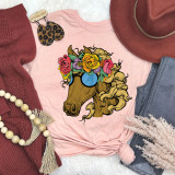 Hippie Horse DTF Heat Transfer, colorful graphic of a horse wearing sunglasses and a floral crown on a pink T-shirt.
