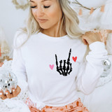 Skeleton Hand With Hearts DTF Heat Transfer, a product image showing a tattoo-style skeleton hand with pink and red hearts on a white background, used for heat transfer on clothing.