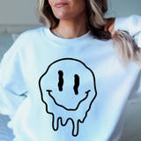 Melting Happy Face DTF Heat Transfer, cheerful smiley face design with melting effect on a white sweatshirt.