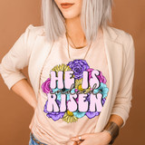 He Is Indeed Risen DTF Heat Transfer, colorful floral Easter-themed design on a woman's t-shirt.