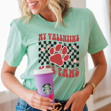 My Valentine Has Paws DTF Heat Transfer, woman wearing a mint green T-shirt with a dog paw print and hearts for Valentine's Day.