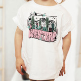 Western DTF Heat Transfer, colorful desert landscape with cacti and mountains on a white t-shirt.