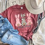 Bunny Season DTF Heat Transfer, Pink T-shirt with three bunny illustrations featuring different patterns and a 'bunny season' text, along with a straw hat, distressed jeans, and jewelry.