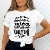 I'm Just Here For The Snacks, Commercials And The Halftime Show DTF Heat Transfer T-shirt worn by a woman with a knotted front, in front of a white chevron background.