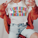 I Love Jesus Screen Print Heat Transfer, a colorful and humorous graphic T-shirt with the phrase 'I Love Jesus But I Will Punch a Hoe' in vibrant pink, orange, and blue lettering.