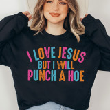 I Love Jesus Screen Print Heat Transfer, colorful and humorous phrase printed on a black sweatshirt worn by a woman.