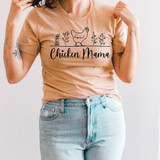Chicken Mama DTF Heat Transfer, close-up of woman wearing a beige t-shirt with a chicken and plant design and the text 'Chicken Mama' printed on it.