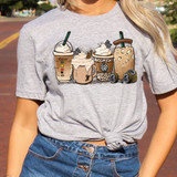 Racing Lattes DTF Heat Transfer, coffee latte drink illustrations printed on a woman's grey T-shirt.